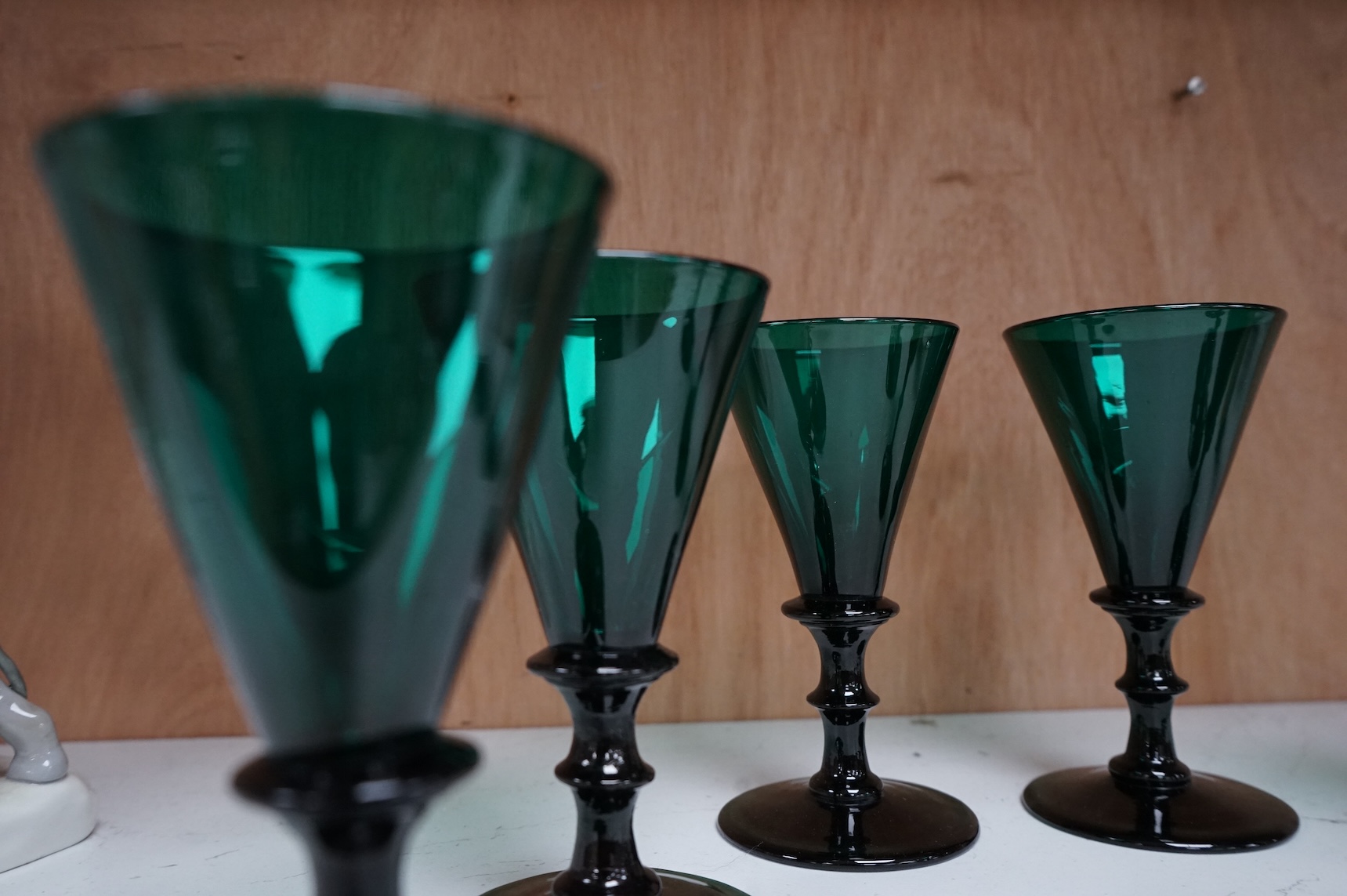 A late Georgian set of six green glasses, 13cm high